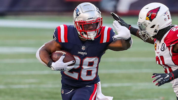 Nov 29, 2020; Foxborough, Massachusetts, USA; New England Patriots running back James White (28) runs the ball against the Arizona Cardinals during the second half at Gillette Stadium. Mandatory Credit: Paul Rutherford-Imagn Images