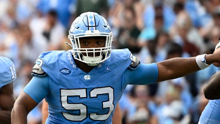 Sep 7, 2024; Chapel Hill, North Carolina, USA; North Carolina Tar Heels quarterback Conner Harrell (15) looks to pass as offensive linemen Trevyon Green (78) and Willie Lampkin (53) block in the second quarter at Kenan Memorial Stadium. Mandatory Credit: Bob Donnan-Imagn Images Sep 7, 2024; Chapel Hill, North Carolina, USA; North Carolina Tar Heels quarterback Conner Harrell (15) looks to pass as offensive linemen Trevyon Green (78) and Willie Lampkin (53) block in the second quarter at Kenan Memorial Stadium. Mandatory Credit: Bob Donnan-Imagn Images
