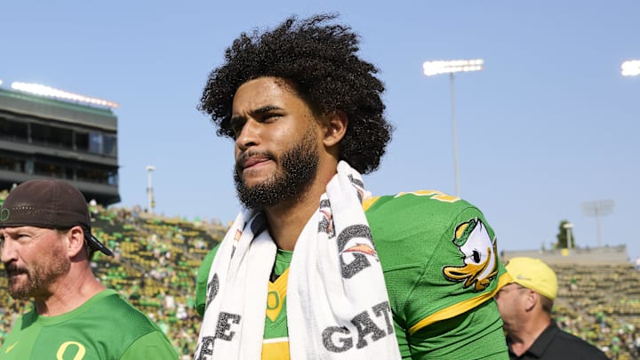 Sep 6, 2025; Eugene, Oregon, USA; Oregon Ducks quarterback Dante Moore (5) walks off the field after a game against the Oklahoma State Cowboys at Autzen Stadium. Mandatory Credit: Troy Wayrynen-Imagn Images