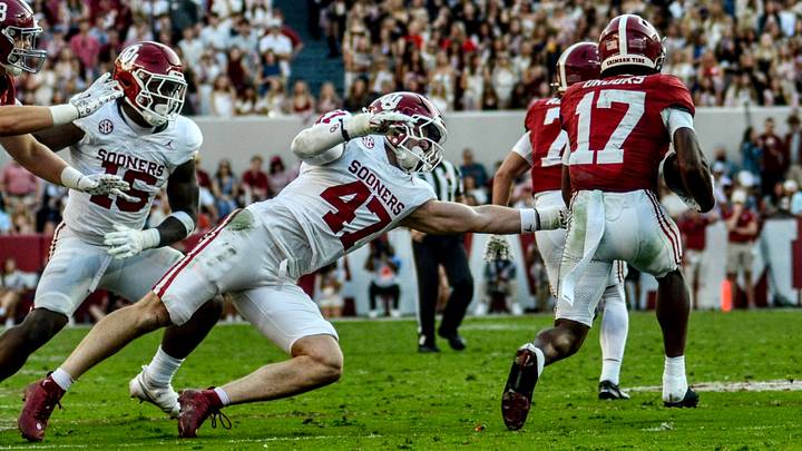 Oklahoma linebacker James Nesta tries to tackle Alabama's Lotzeir Brooks.