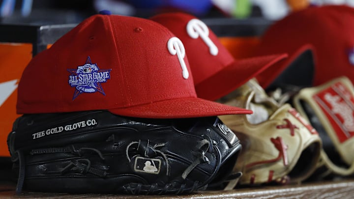 May 2, 2026; Miami, Florida, USA; Philadelphia Phillies starting hats and gloves sit on the bench against the Miami Marlins during the fifth inning at loanDepot Park. May 2, 2026; Miami, Florida, USA; Philadelphia Phillies starting hats and gloves sit on the bench against the Miami Marlins during the fifth inning at loanDepot Park.