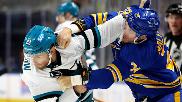 Mar 10, 2026; Buffalo, New York, USA;  San Jose Sharks center Barclay Goodrow (23) and Buffalo Sabres left wing Beck Malenstyn (29) fight during the first period at KeyBank Center. Mandatory Credit: Timothy T. Ludwig-Imagn Images