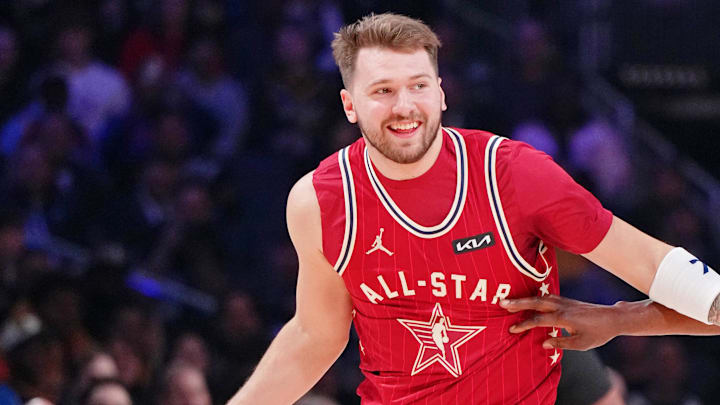 Feb 18, 2024; Indianapolis, Indiana, USA; Western Conference forward Luka Doncic (77) of the Dallas Mavericks dribbles the ball against Eastern Conference center Bam Adebayo (13) of the Miami Heat during the first half of the 73rd NBA All Star game at Gainbridge Fieldhouse. Mandatory Credit: Kyle Terada-Imagn Images