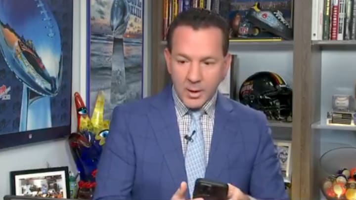 Ian Rapoport receives Sean McDermott news during live hit.