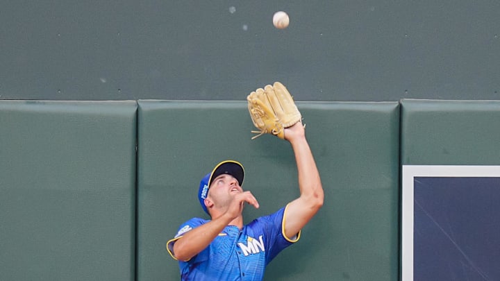 Aug 8, 2025; Minneapolis, Minnesota, USA; Minnesota Twins outfielder Matt Wallner (38) fields a fly ball against the Kansas City Royals in the first inning at Target Field. Mandatory Credit: Brad Rempel-Imagn Images