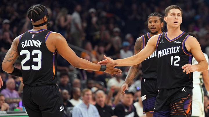 Mar 21, 2026; Phoenix, Arizona, USA; Phoenix Suns guard Jordan Goodwin (23) and Phoenix Suns guard Collin Gillespie (12) slap hands against the Milwaukee Bucks during the first half at Mortgage Matchup Center. Mandatory Credit: Joe Camporeale-Imagn Images Mar 21, 2026; Phoenix, Arizona, USA; Phoenix Suns guard Jordan Goodwin (23) and Phoenix Suns guard Collin Gillespie (12) slap hands against the Milwaukee Bucks during the first half at Mortgage Matchup Center. Mandatory Credit: Joe Camporeale-Imagn Images