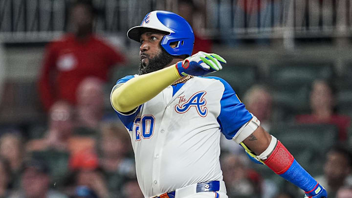 Aug 9, 2025; Cumberland, Georgia, USA; Atlanta Braves designated hitter Marcell Ozuna (20) bats against the Miami Marlins during the sixth inning at Truist Park. Mandatory Credit: Dale Zanine-Imagn Images