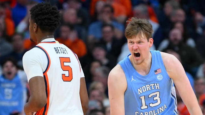 Feb 21, 2026; Syracuse, New York, USA; North Carolina Tar Heels center Henri Veesaar (13) reacts to a play past Syracuse Orange forward Tyler Betsey (5) during the second half at the JMA Wireless Dome. Mandatory Credit: Rich Barnes-Imagn Images Feb 21, 2026; Syracuse, New York, USA; North Carolina Tar Heels center Henri Veesaar (13) reacts to a play past Syracuse Orange forward Tyler Betsey (5) during the second half at the JMA Wireless Dome. Mandatory Credit: Rich Barnes-Imagn Images