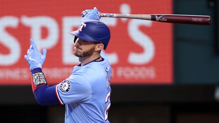 Texas Rangers catcher Jonah Heim (28) singles in a run during the third inning against the Atlanta Braves at Globe Life Field. 