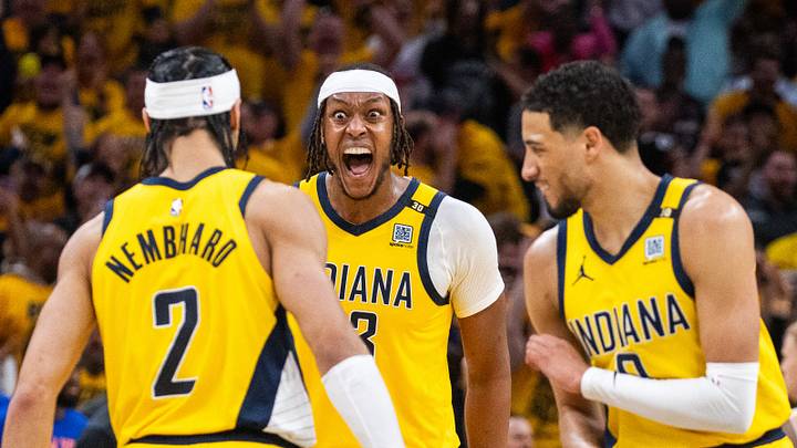 May 10, 2024; Indianapolis, Indiana, USA; Indiana Pacers center Myles Turner (33) reacts to guard Andrew Nembhard (2) celebrates his game clinching three-point basket during game three of the second round for the 2024 NBA playoffs against the New York Knicks at Gainbridge Fieldhouse. Mandatory Credit: Trevor Ruszkowski-USA TODAY Sports