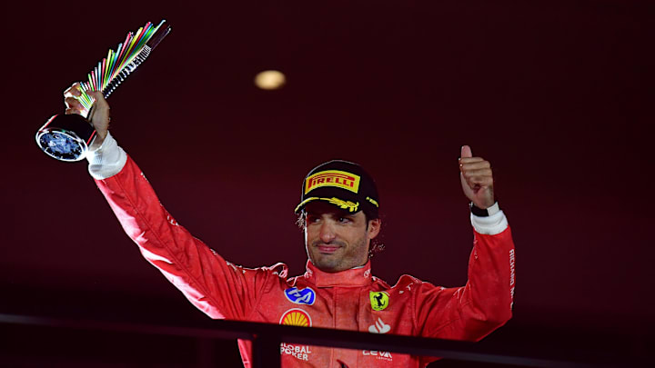 Nov 23, 2024; Las Vegas, Nevada, USA; Scuderia Ferrari driver Carlos Sainz (55) celebrates after placing third in the Las Vegas Grand Prix at Las Vegas Circuit. Mandatory Credit: Gary A. Vasquez-Imagn Images