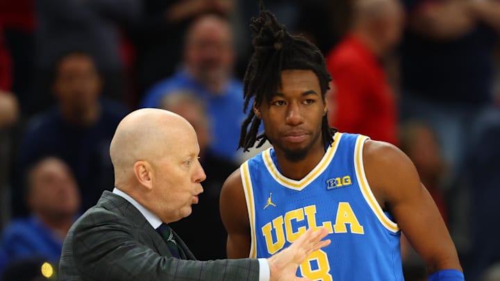 Dec 14, 2024; Phoenix, Arizona, USA; UCLA Bruins head coach Mick Cronin with guard Dominick Harris (8) against the Arizona Wildcats at Footprint Center. Mandatory Credit: Mark J. Rebilas-Imagn Images