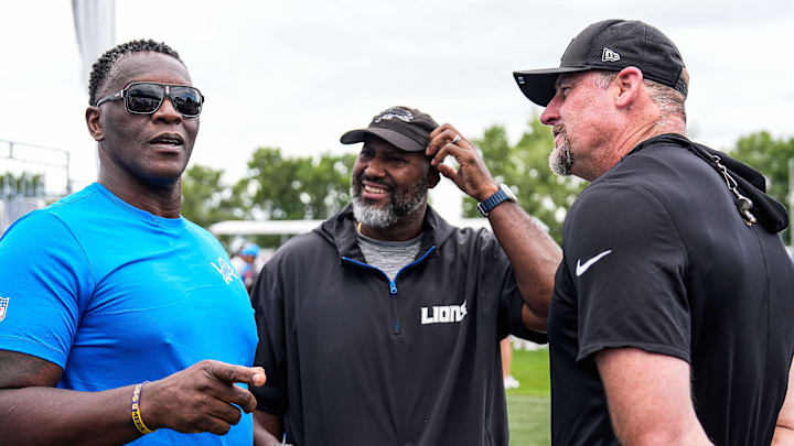 Former Lions player Robert Porcher, left, talks to general manager Brad Holmes, center, and head coach Dan Campbell Former Lions player Robert Porcher, left, talks to general manager Brad Holmes, center, and head coach Dan Campbell