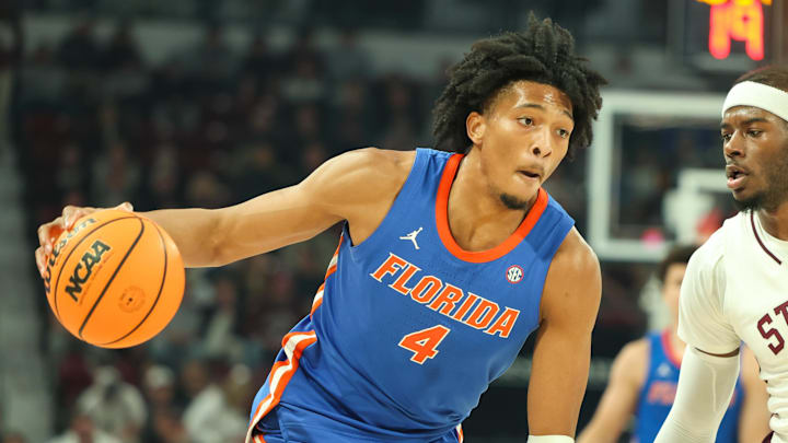 Feb 11, 2025; Starkville, Mississippi, USA; Florida Gators forward Sam Alexis (4) drives against Mississippi State Bulldogs forward Cameron Matthews (4) during the first half at Humphrey Coliseum. Mandatory Credit: Wesley Hale-Imagn Images Feb 11, 2025; Starkville, Mississippi, USA; Florida Gators forward Sam Alexis (4) drives against Mississippi State Bulldogs forward Cameron Matthews (4) during the first half at Humphrey Coliseum. Mandatory Credit: Wesley Hale-Imagn Images