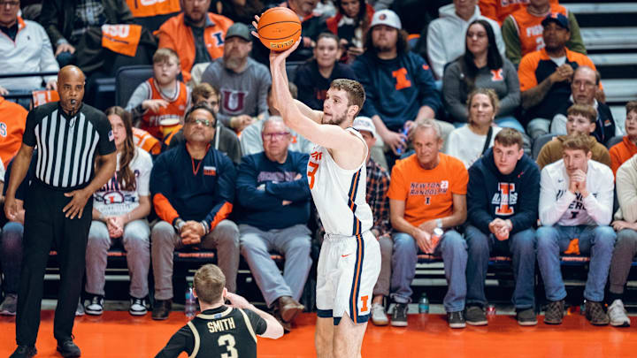 Illinois center Tomislav Ivisic (13) pulls up for a three-point attempt over Purdue guard Braden Smith (3) in the Illini's 88-80 win over the Boilermakers in the 2024-25 regular-season finale on March 7, 2025, at the State Farm Center in Champaign, Illinois.