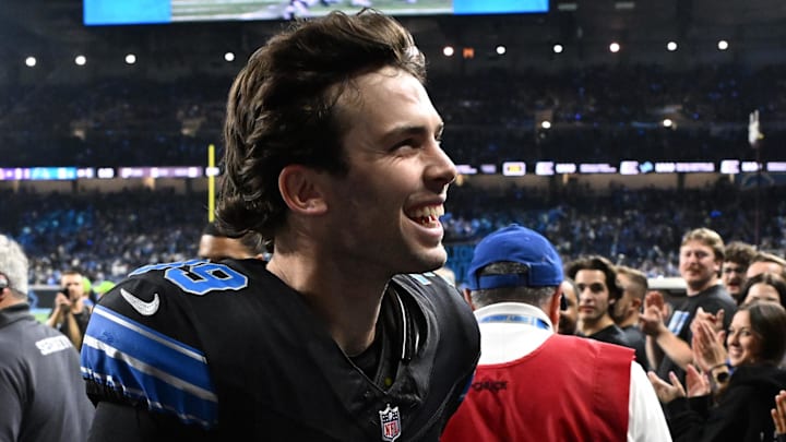 Detroit Lions place kicker Jake Bates celebrates with fans as he runs off the field following the Lions win over the Minnesota Vikings at Ford Field last Sunday night. The win earned the Lions a bye and the No. 1 seed in the NFC.