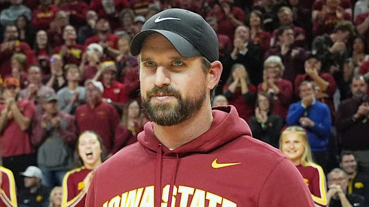 Iowa State football coach Jimmy Rogers speaks during a timeout in the first half in the Iowa State and Iowa men’s basketball Cy-Hawk series at Hilton coliseum on Dec. 11, 2025, in Ames, Iowa. Iowa State football coach Jimmy Rogers speaks during a timeout in the first half in the Iowa State and Iowa men’s basketball Cy-Hawk series at Hilton coliseum on Dec. 11, 2025, in Ames, Iowa.