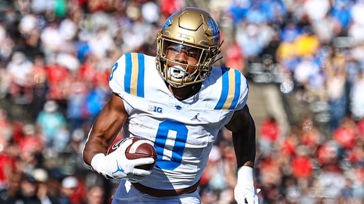 Oct 19, 2024; Piscataway, New Jersey, USA; UCLA Bruins running back Jalen Berger (0) catches a pass for a touchdown as Rutgers Scarlet Knights linebacker Abram Wright (11) pursues during the second half at SHI Stadium. Oct 19, 2024; Piscataway, New Jersey, USA; UCLA Bruins running back Jalen Berger (0) catches a pass for a touchdown as Rutgers Scarlet Knights linebacker Abram Wright (11) pursues during the second half at SHI Stadium.