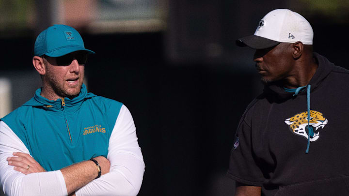 Jacksonville Jaguars Head Coach Liam Coen, left, talks with Assistant Strength and Conditioning Coach Julian Whitehead during the Jacksonville Jaguars’ 18th and final training camp practice at Miller Electric Center in Jacksonville, Fla. Wednesday August 20, 2025. [Doug Engle/Florida Times-Union]