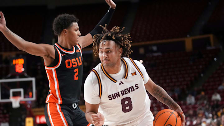ASU Sun Devils forward Marcus Adams Jr. (8) drives past Oregon State Beavers guard Josiah Lake II (2) at Desert Financial Arena in Tempe on Dec. 21, 2025.