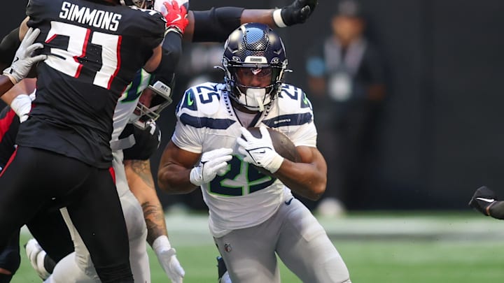 Oct 20, 2024; Atlanta, Georgia, USA; Seattle Seahawks running back Kenny McIntosh (25) runs the ball against the Atlanta Falcons in the fourth quarter at Mercedes-Benz Stadium. Mandatory Credit: Brett Davis-Imagn Images