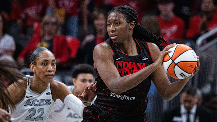  Indiana Fever forward Aliyah Boston (7) holds the ball while Las Vegas Aces center A'ja Wilson (22) on September 28, 2025