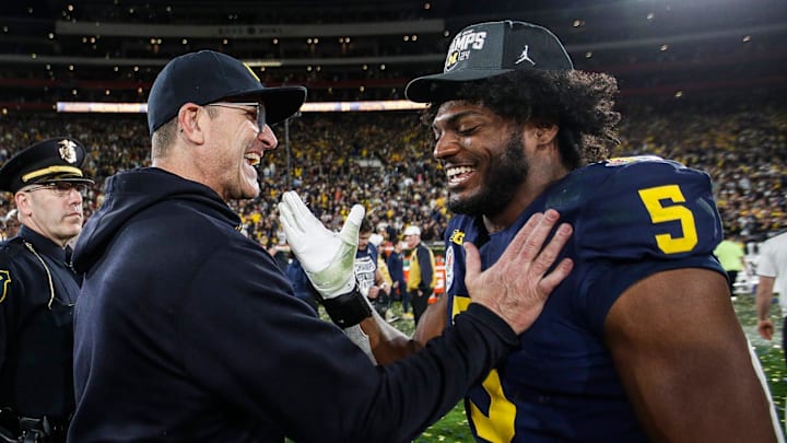 Michigan coach Jim Harbaugh celebrates with defensive end Josaiah Stewart after the 27-20 overtime win in the Rose Bowl over Alabama at Rose Bowl Stadium in Pasadena, California, on Monday, Jan. 1, 2024.