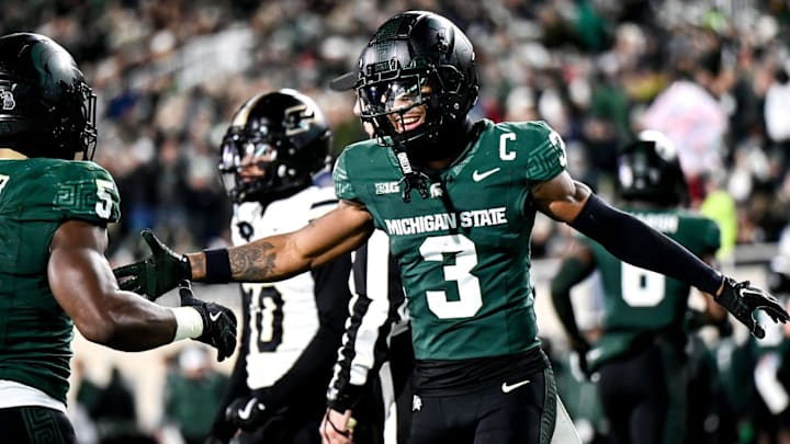 Michigan State's Montorie Foster Jr., right, celebrates with Nathan Carter, left, after Carter's touchdown against Purdue during the second quarter on Friday, Nov. 22, 2024, at Spartan Stadium in East Lansing.