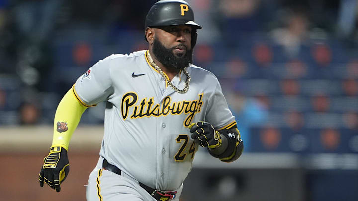 Mar 28, 2026; New York City, New York, USA; Pittsburgh Pirates designated hitter Marcell Ozuna (24) runs out a single against the New York Mets during the eleventh inning at Citi Field.