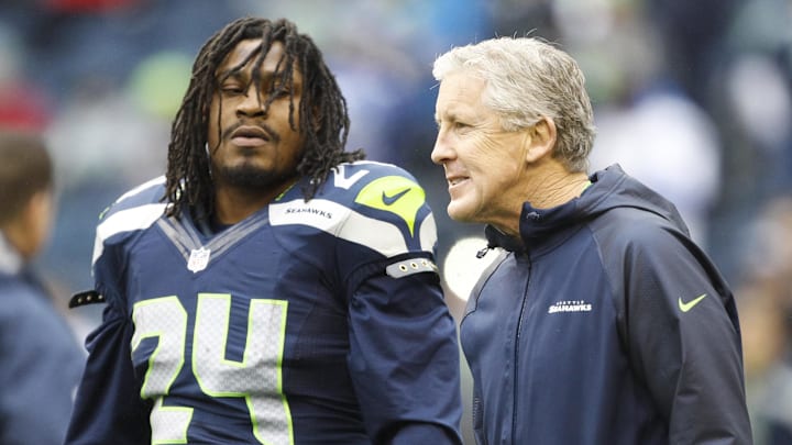 Dec 22, 2013; Seattle, WA, USA; Seattle Seahawks head coach Pete Carroll talks with Seattle Seahawks running back Marshawn Lynch (24) during pre game warmups against the Arizona Cardinals at CenturyLink Field. Mandatory Credit: Joe Nicholson-Imagn Images