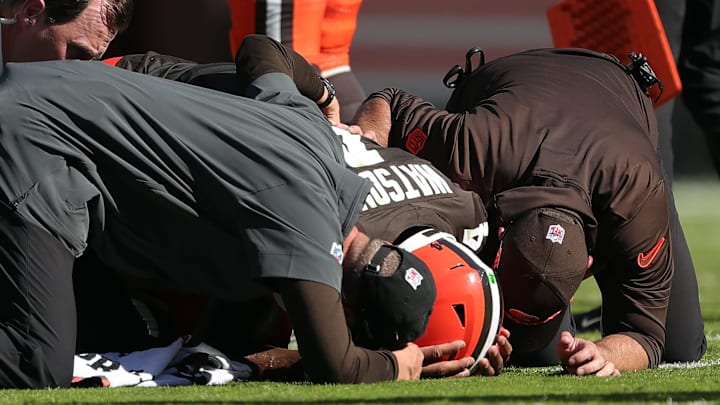 Cleveland Browns quarterback Deshaun Watson is checked on by medical staff after an injury during a game against the Cincinnati Bengals on Oct. 20, 2024, in Cleveland, Ohio.