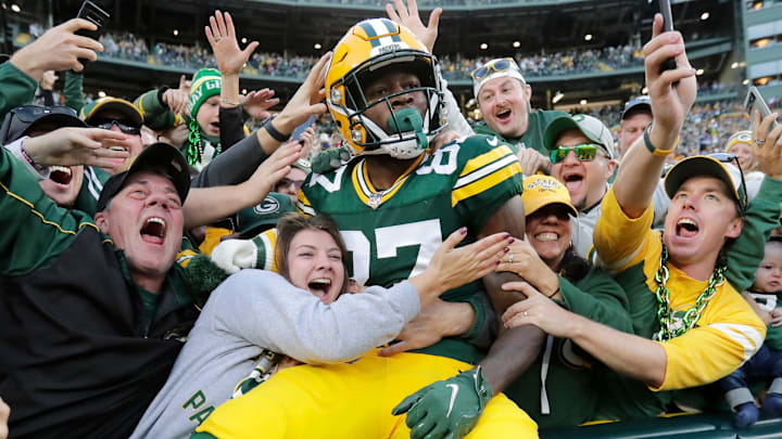 Green Bay Packers wide receiver Romeo Doubs celebrates with fans after scoring a touchdown against the New England Patriots on Oct. 2 at Lambeau Field. Green Bay Packers wide receiver Romeo Doubs celebrates with fans after scoring a touchdown against the New England Patriots on Oct. 2 at Lambeau Field.
