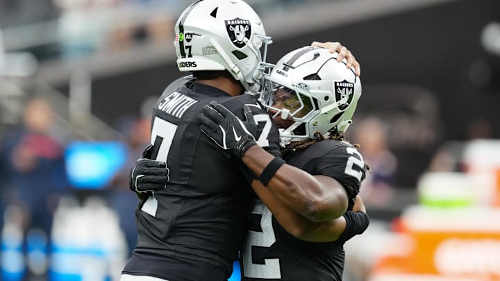 Sep 28, 2025; Paradise, Nevada, USA; Las Vegas Raiders quarterback Geno Smith (7) and running back Ashton Jeanty (2) hug prior to the game against the Chicago Bears at Allegiant Stadium. Mandatory Credit: Stephen R. Sylvanie-Imagn Images Sep 28, 2025; Paradise, Nevada, USA; Las Vegas Raiders quarterback Geno Smith (7) and running back Ashton Jeanty (2) hug prior to the game against the Chicago Bears at Allegiant Stadium. Mandatory Credit: Stephen R. Sylvanie-Imagn Images