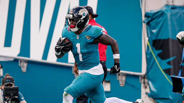 Dec 14, 2025; Jacksonville, Florida, USA;Jacksonville Jaguars running back Travis Etienne Jr. (1) runs for a touchdown against the New York Jets at EverBank Stadium. Mandatory Credit: Travis Register-Imagn Images