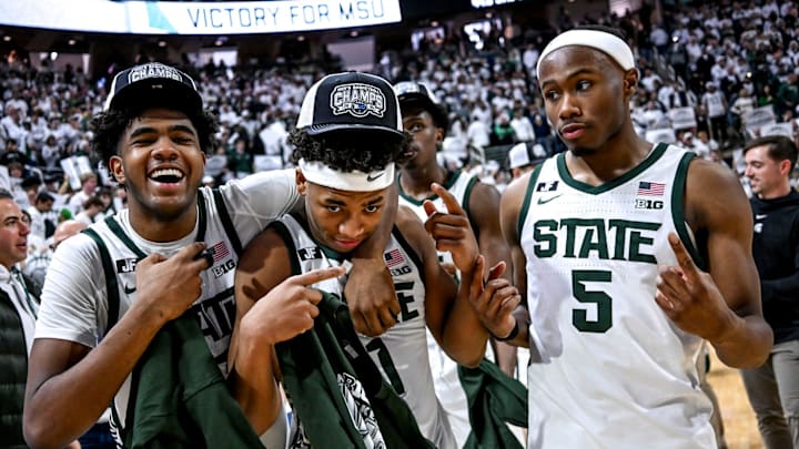 Form left, Michigan State's Jase Richardson, Jeremy Fears Jr. and Tre Holloman celebrate their win over Michigan on Sunday, March 9, 2025, at the Breslin Center in East Lansing.