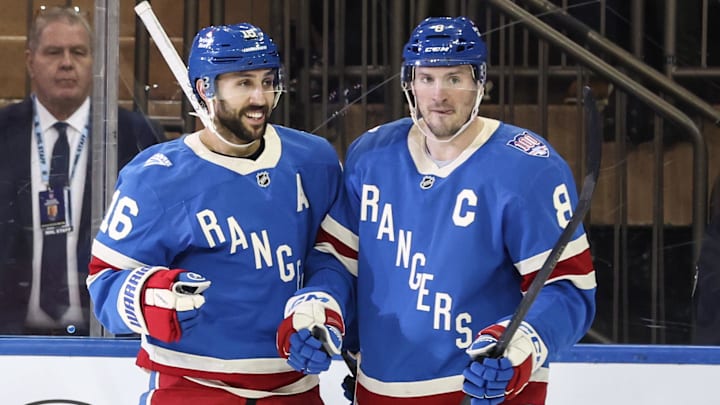 Jan 8, 2026; New York, New York, USA;  New York Rangers center Vincent Trocheck (16) celebrates with center J.T. Miller (8) after scoring a goal in the third period against the Buffalo Sabres at Madison Square Garden. Mandatory Credit: Wendell Cruz-Imagn Images