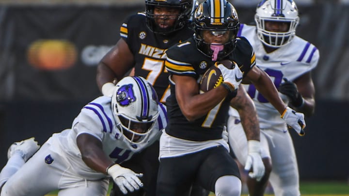 Aug 28, 2025; Columbia, MO, USA; Missouri Tigers wide receiver Donovan Olugdobe (1) catches a pass against the Central Arkansas Bears with the backdrop of the Memorial Stadium renovation behind.