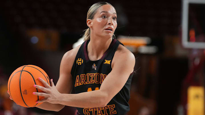 ASU Sun Devils guard Marley Washenitz (11) looks to pass the ball against the Kansas State Wildcats at Desert Financial Arena in Tempe on Feb. 1, 2026. ASU Sun Devils guard Marley Washenitz (11) looks to pass the ball against the Kansas State Wildcats at Desert Financial Arena in Tempe on Feb. 1, 2026.