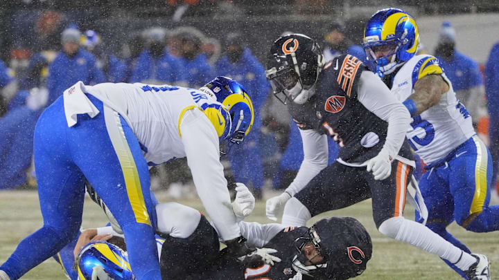 Jan 18, 2026; Chicago, IL, USA; Los Angeles Rams offensive tackle Warren McClendon Jr. (71) reacts after quarterback Matthew Stafford (9) (obscured) is sacked by Chicago Bears defensive end Dominique Robinson (90) during the third quarter of an NFC Divisional Round game at Soldier Field. Mandatory Credit: David Banks-Imagn Images