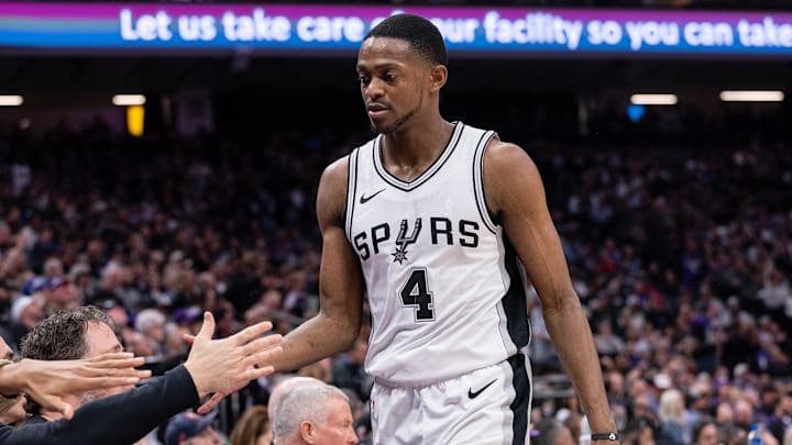 Mar 7, 2025; Sacramento, California, USA; San Antonio Spurs guard De'Aaron Fox (4) high fives team mates after coming out of the game during the fourth quarter at Golden 1 Center. Mandatory Credit: Ed Szczepanski-Imagn Images
