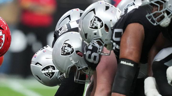 Jan 4, 2026; Paradise, Nevada, USA; Helmets at the line of scrimmage as Las Vegas Raiders long snapper Jacob Bobenmoyer (50) snaps the ball against the Kansas City Chiefs in the first half at Allegiant Stadium. Mandatory Credit: Kirby Lee-Imagn Images Jan 4, 2026; Paradise, Nevada, USA; Helmets at the line of scrimmage as Las Vegas Raiders long snapper Jacob Bobenmoyer (50) snaps the ball against the Kansas City Chiefs in the first half at Allegiant Stadium. Mandatory Credit: Kirby Lee-Imagn Images
