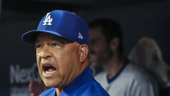 Dodgers manager Dave Roberts (30) reacts in the dugout against the Atlanta Braves during the second inning at Truist Park on May 3. Dodgers manager Dave Roberts (30) reacts in the dugout against the Atlanta Braves during the second inning at Truist Park on May 3.