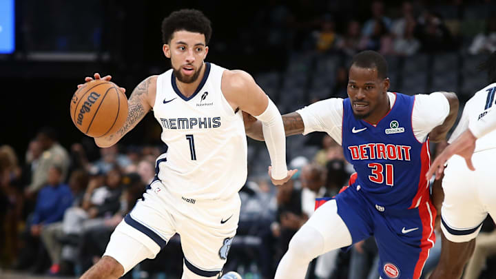 Oct 6, 2025; Memphis, Tennessee, USA; Memphis Grizzlies guard Scotty Pippen Jr. (1) dribbles around a screen set by forward Olivier-Maxence Prosper (18) on Detroit Pistons guard Javonte Green (31) during the fourth quarter at FedExForum. Oct 6, 2025; Memphis, Tennessee, USA; Memphis Grizzlies guard Scotty Pippen Jr. (1) dribbles around a screen set by forward Olivier-Maxence Prosper (18) on Detroit Pistons guard Javonte Green (31) during the fourth quarter at FedExForum.
