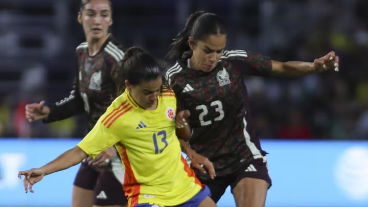 Colombia midfielder Ilana Izquierdo (13) and Mexico forward Maricarmen Reyes (23) battle for positioning in the second half at Inter & Co Stadium. Colombia midfielder Ilana Izquierdo (13) and Mexico forward Maricarmen Reyes (23) battle for positioning in the second half at Inter & Co Stadium.