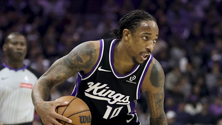 Nov 24, 2025; Sacramento, California, USA; Sacramento Kings forward DeMar DeRozan (10) controls the ball while being defended by Minnesota Timberwolves guard Terrence Shannon Jr. (1) during the first quarter at Golden 1 Center.