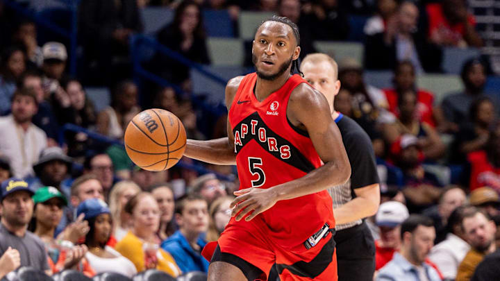 Mar 11, 2026; New Orleans, Louisiana, USA;  Toronto Raptors guard Immanuel Quickley (5) brings the ball up court against New Orleans Pelicans guard Dejounte Murray (5) during the second half at Smoothie King Center. Mandatory Credit: Stephen Lew-Imagn Images