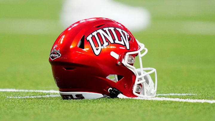 A UNLV Rebels helmet sits on the field during the second half of a game between the UNLV Rebels and the Hawaii Warriors at Allegiant Stadium on September 30, 2023 in Las Vegas, Nevada. Rebels defeat the Warriors 44-20.