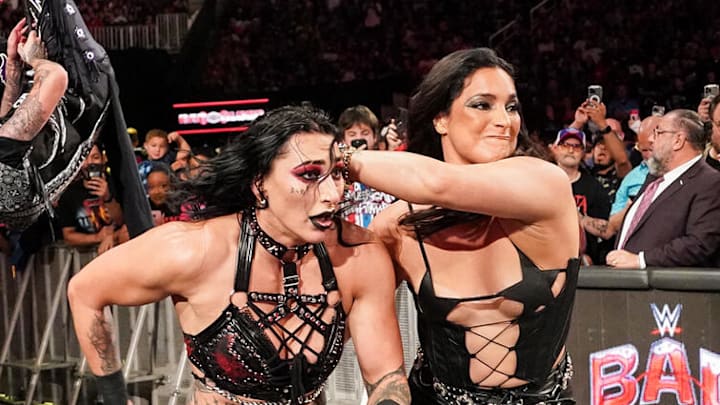 Raquel Rodriguez (right) returns at WWE Bad Blood to help Liv Morgan against Rhea Ripley (left).