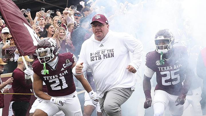 Texas A&M Aggies head coach Mike Elko takes the field prior to the game against the Miami Hurricanes during the first round of the CFP National Playoff at Kyle Field. 