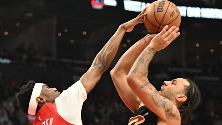 Apr 26, 2026; Toronto, Ontario, CAN;  Toronto Raptors guard Ja'Kobe Walter (14) blocks a shot from Cleveland Cavaliers guard Jaylon Tyson (20) during game four of the first round of the 2026 NBA Playoffs at Scotiabank Arena. Mandatory Credit: Dan Hamilton-Imagn Images
